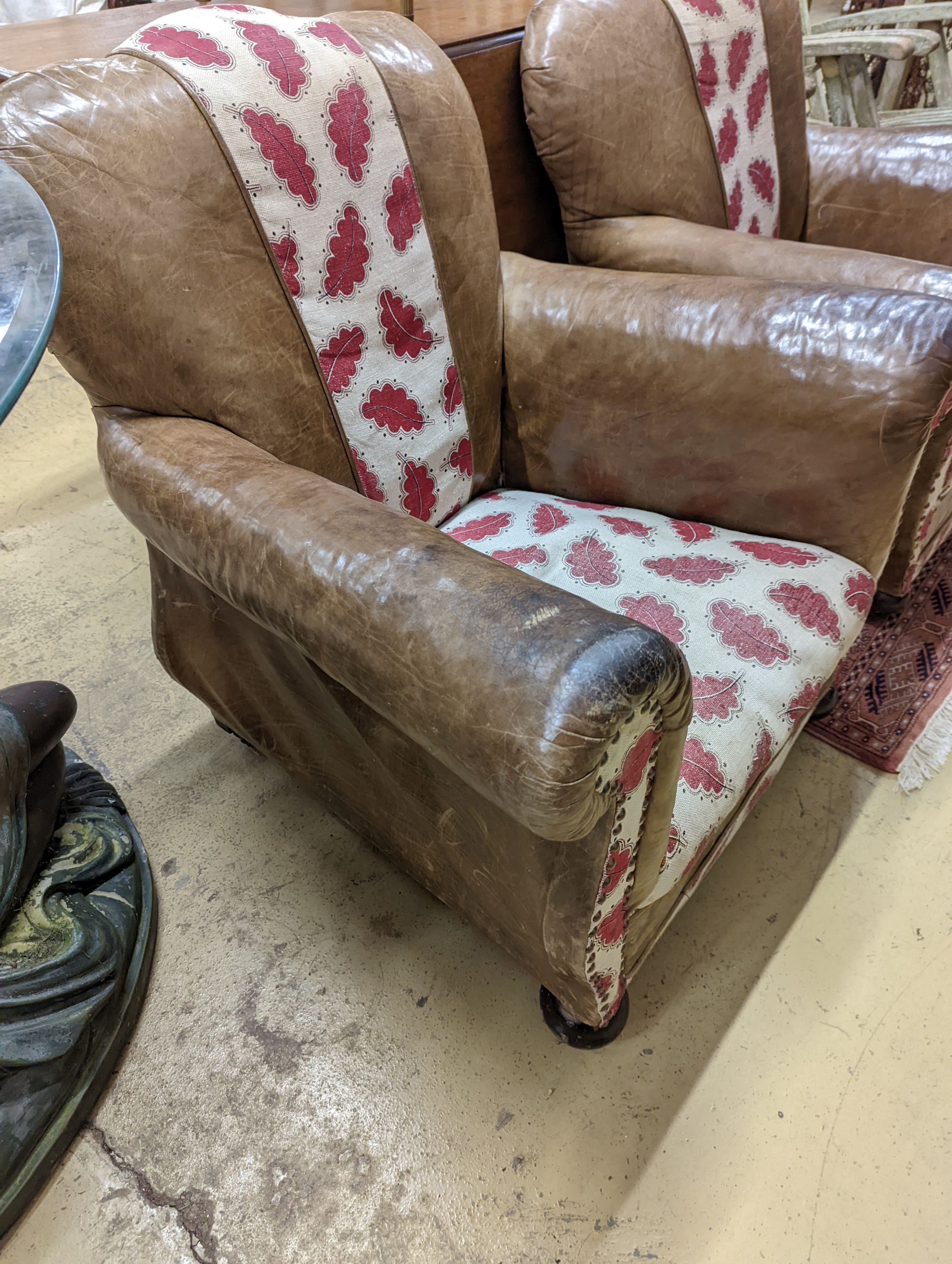 A pair of leather and fabric club armchairs. H-80cm.